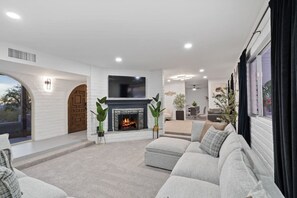 Smart TV, fireplace, books