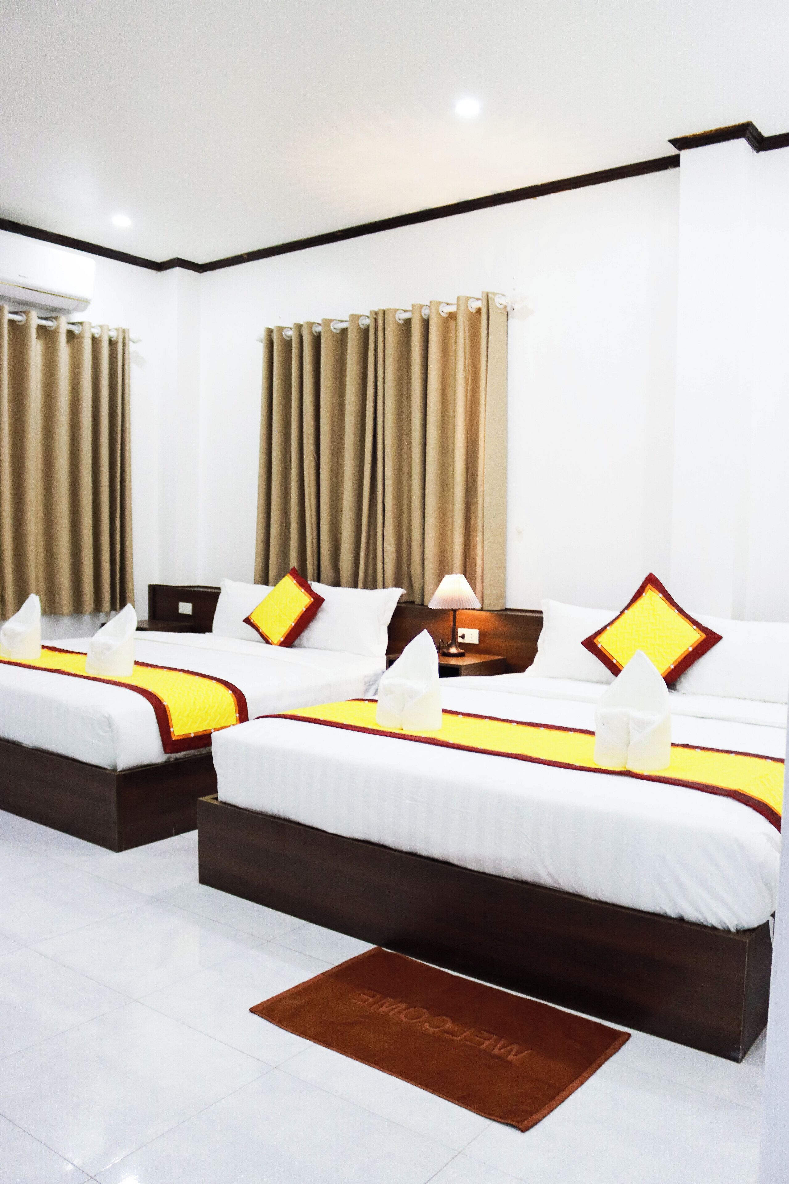 Deluxe Quadruple Room | In-room safe, desk