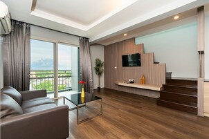 Deluxe Duplex | Living area | TV