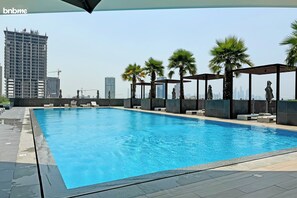 Outdoor pool, a heated pool - bnbme | Bloom Heights | 1 BDR (Dubai)