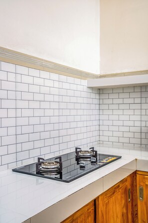 Villa | Private kitchen | Full-size fridge, microwave, cookware/dishes/utensils, cleaning supplies