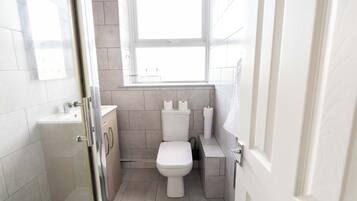 Shower, hair dryer, towels