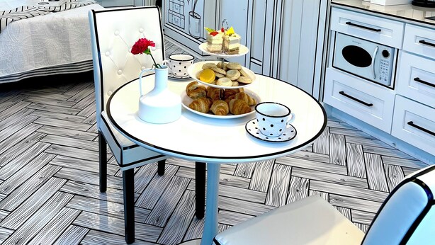 A modern hotel room with a dining area featuring a white table with a white and black polka dot tablecloth, a vase with red flowers, and a plate of pastries.