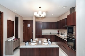 Junior Suite Two Bedroom | Private kitchen | Fridge, microwave, oven, stovetop