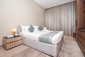 Junior Suite Two Bedroom | Iron/ironing board, rollaway beds, free WiFi, bed sheets - Eden Garden Hotel Apartment (Manama)