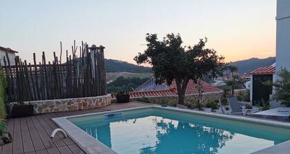 In the heart of the medieval town next to Penela Castle.