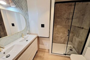 Shower, hair dryer, towels, soap