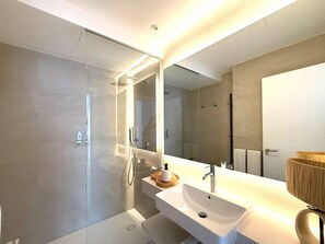 Shower, hair dryer, towels, toilet paper