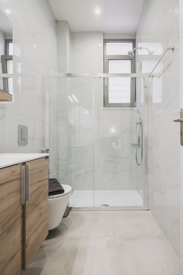 Shower, hair dryer, towels, soap