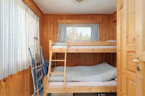 A wooden bunk bed room with a window, curtains, and a ladder. - Bestefarhaugen - the Cozy House on the Hill,& Dome (Bø)