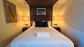 Premium bedding, memory-foam beds, in-room safe, laptop workspace