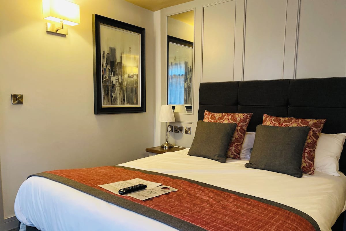 Premium bedding, memory foam beds, in-room safe, laptop workspace