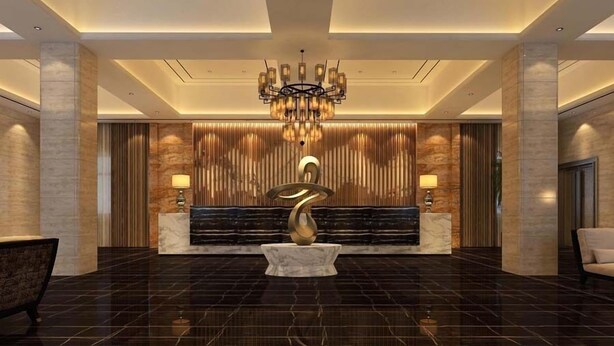 A spacious lobby with a marble floor, a central seating area with a bench, a decorative wall panel, and a chandelier. - Qin Mengli Hotel (Xianyang)
