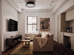 55-inch flat-screen TV with digital channels, streaming services