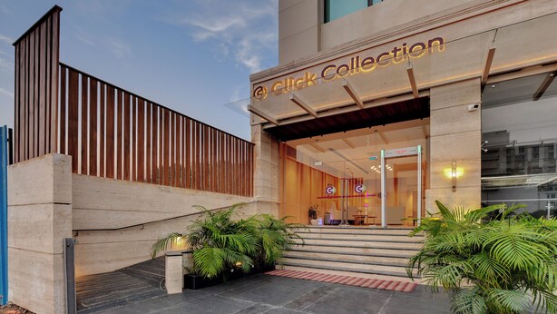 A modern building with a sign reading "Click Collection." - Click collection Lucknow (Lucknow)