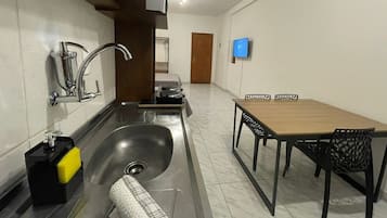 Apartment | Private kitchen | Fridge, microwave, stovetop, cookware/dishes/utensils