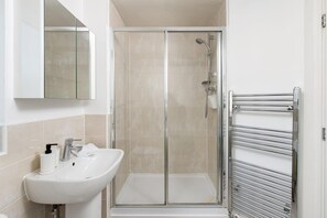 Shower, hair dryer, towels, soap