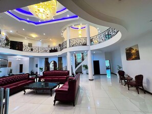 49-inch flat-screen TV with cable channels, iPod dock, MP3 dock - Golden Palm Hotel Boutique (Harare)