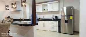 Microwave, coffee/tea maker, cookware/dishes/utensils, spices