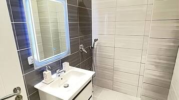 Shower, hair dryer, towels, soap