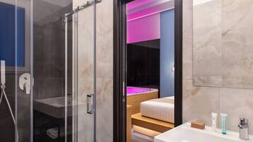 Deluxe Suite | Bathroom | Hair dryer, slippers, towels, soap