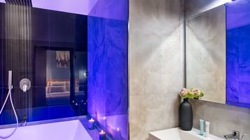 Suite | Bathroom | Hair dryer, slippers, towels, soap