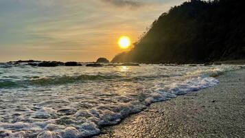 On the beach, sun loungers, beach towels