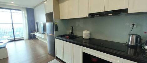 Fridge, stovetop, electric kettle, cookware/dishes/utensils