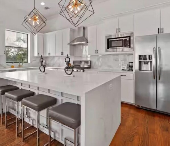 Fridge, coffee/tea maker, electric kettle, high chair - Midtown Luxe: Chic Home Near Downtown Hotspots (Houston)