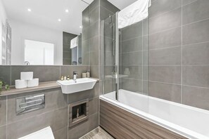 Shower, towels, soap, toilet paper