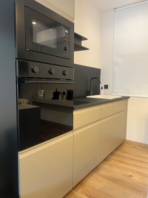 Panoramic Studio Suite, Sea View | Private kitchen | Oven, espresso maker, coffee/tea maker, electric kettle - Apollonio Suites (Corinth)