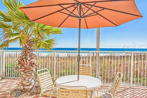 Outdoor dining - Beachfront condo with pool, tennis court breath taking balcony views & internet (Orange Beach)