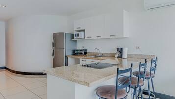 Fridge, microwave, stovetop, coffee/tea maker