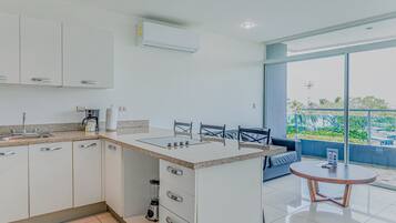 Fridge, microwave, stovetop, coffee/tea maker