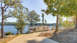 A lakeside cabin with a deck, a driveway, and a view of the lake. - Decks & Boat Dock: 'The View on Lay Lake!' (Shelby)