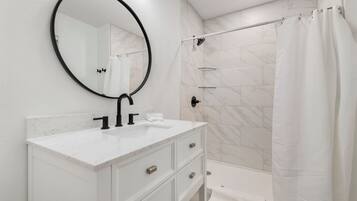 Shower, towels, soap, toilet paper