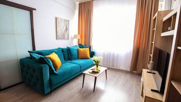 Exclusive Apartment | Living area | Flat-screen TV