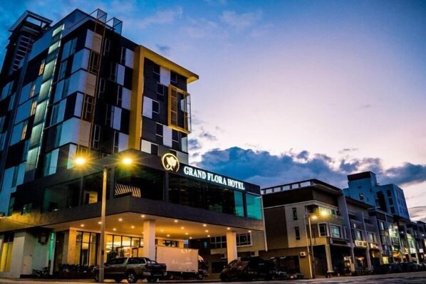 A hotel with a prominent sign, multiple floors, and a modern architectural design. - Grand Flora Hotel (Melaka)