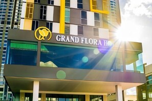 A hotel sign with the name 'Grand Flora Hotel' and a logo. - Grand Flora Hotel (Melaka)