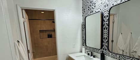 Shower, hair dryer, towels, soap