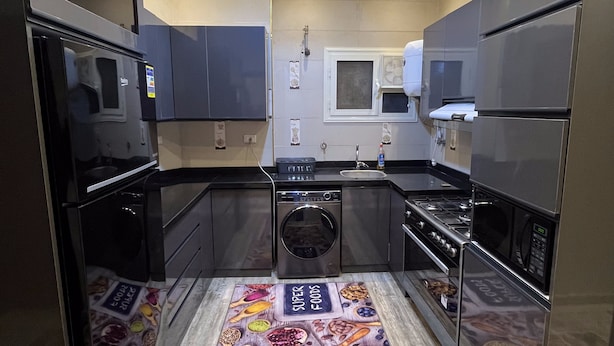 Fridge, microwave, oven, stovetop - "Spacious 3-BR Apt Near AUC, SODIC & Key New Cairo Attractions" (Cairo)