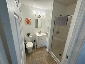 Shower, hair dryer, towels, soap