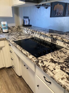 Fridge, dishwasher, cookware/dishes/utensils, dining tables