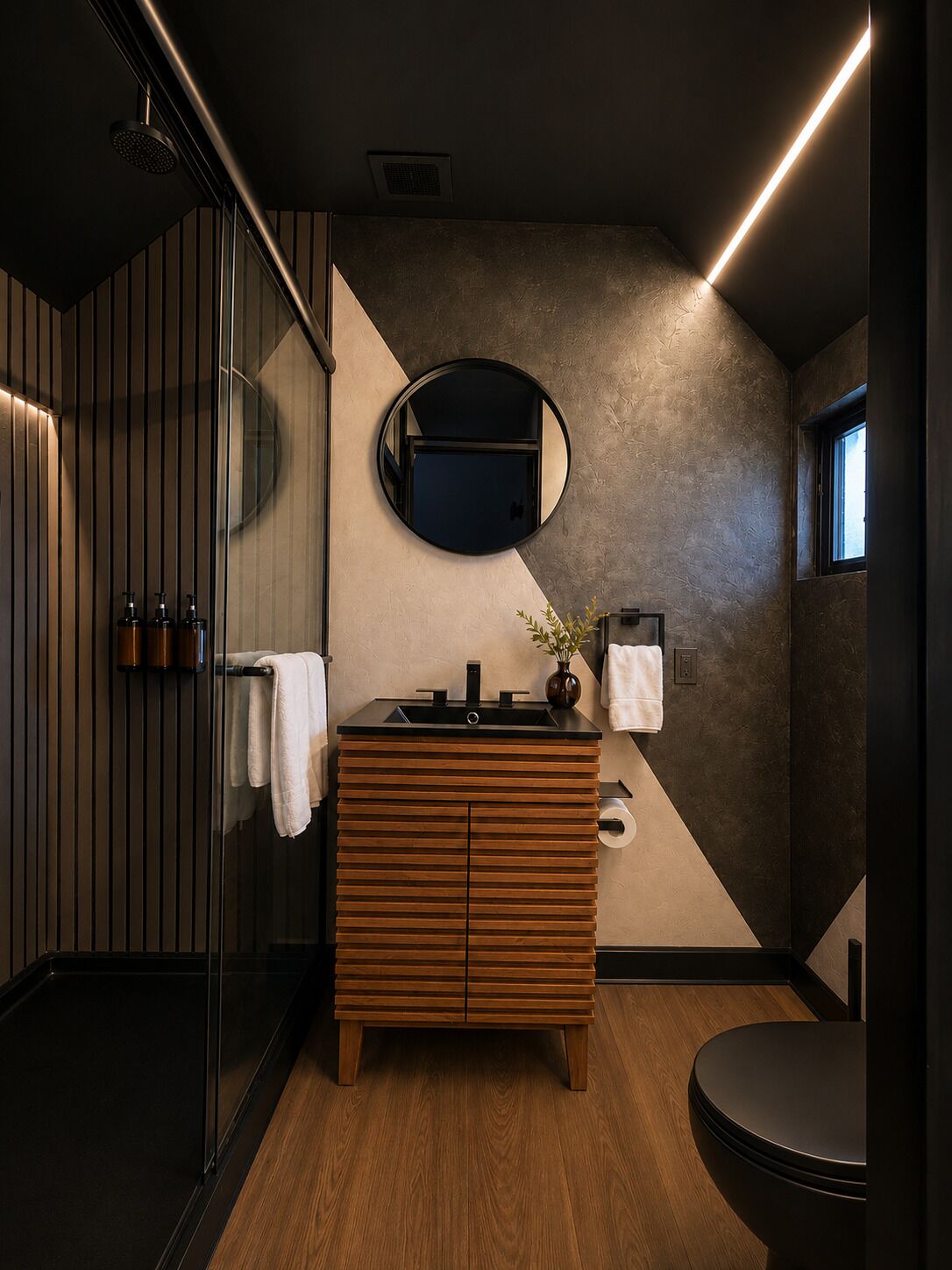A modern bathroom with a wooden vanity, a round mirror, and a glass shower enclosure.