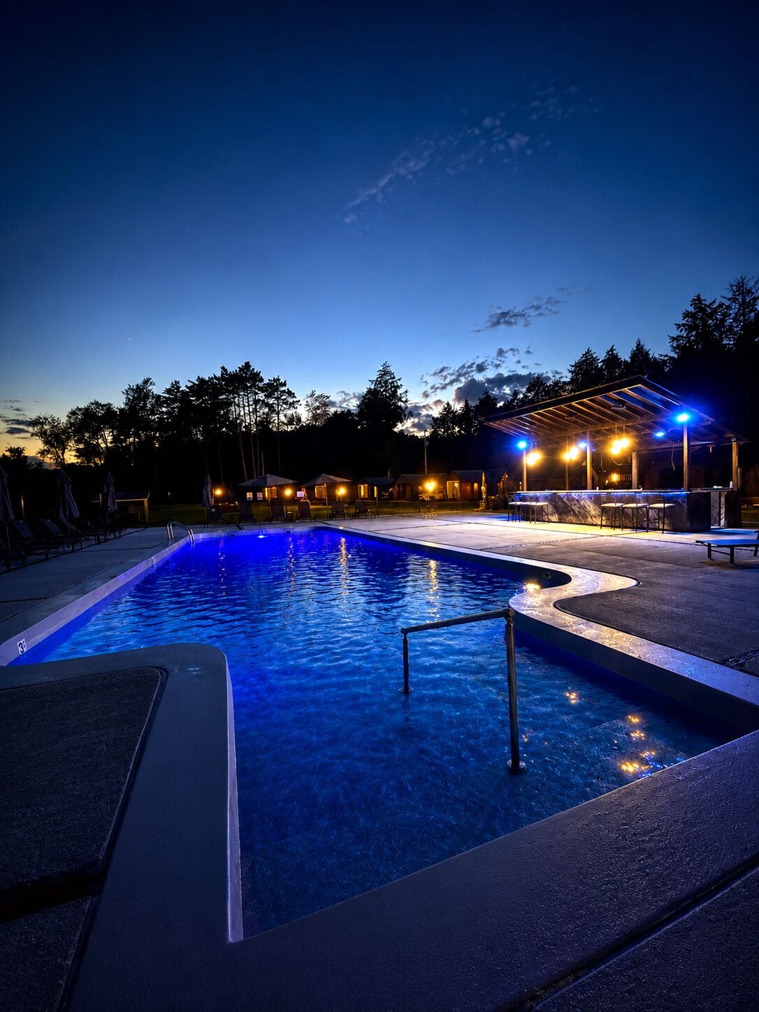 Seasonal outdoor pool, open 6:00 AM to 10:00 PM, pool umbrellas