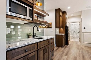 Fridge, microwave, coffee/tea maker, cookware/dishes/utensils