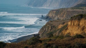 A coastal landscape with cliffs and the ocean. - Seagull by OceanviewHotTubs Oceanfront Tesla charging Oceanfront Shelter Cove (Whitethorn)