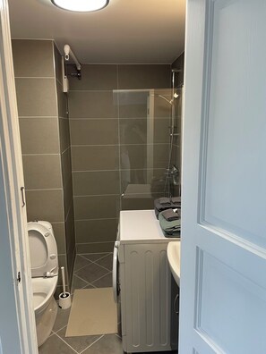 Shower, hair dryer, towels, soap