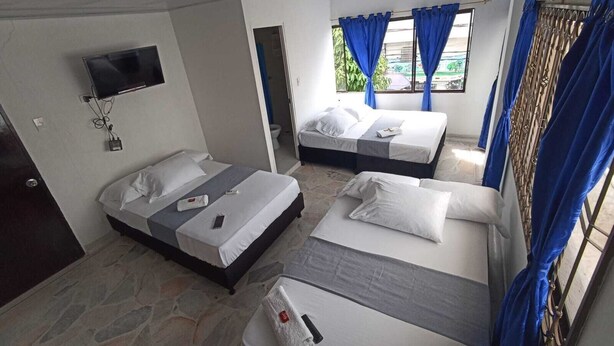 Standard Quadruple Room, Balcony, City View | WiFi (free), bed sheets - Hotel Santander Express (Neiva)