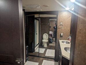 Shower, hair dryer, towels, soap